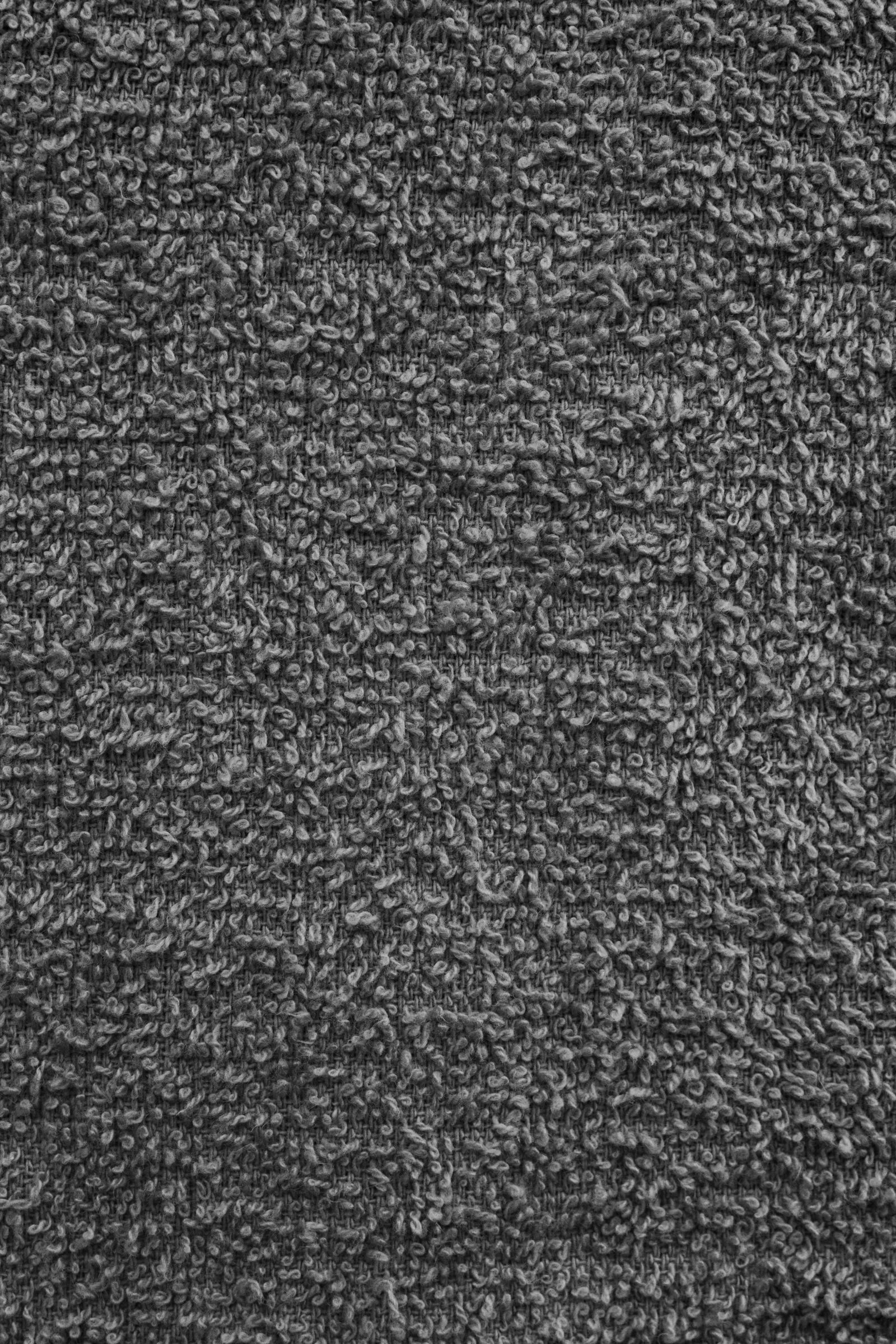 Dense loop carpet in charcoal